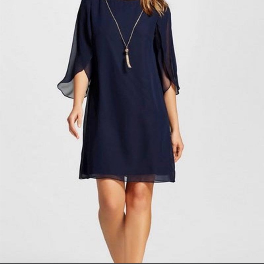 NWT navy dress with sheer petal sleeves and gold chain detail